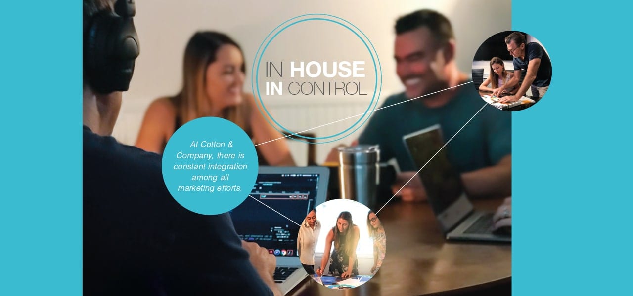 Cotton Company employees around a table