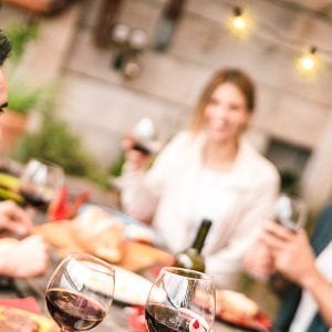 Gathering of Friends at a Table Outdoors