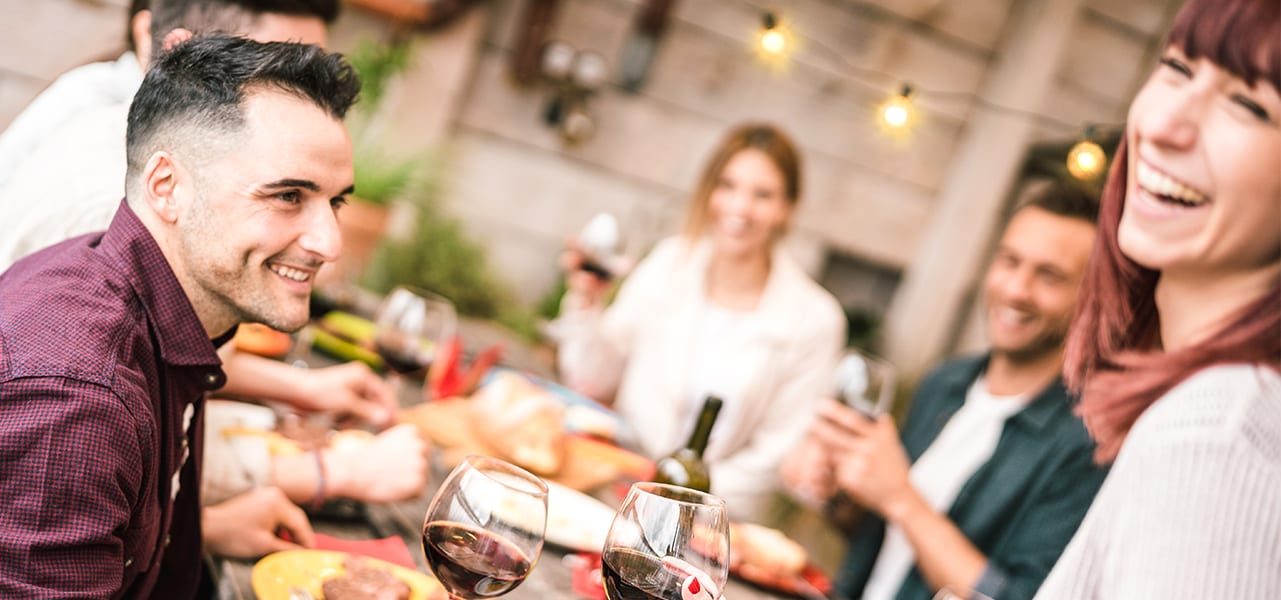 Gathering of Friends at a Table Outdoors