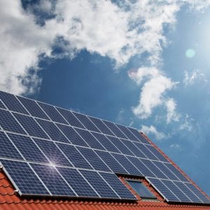 eco-friendly home with solar panels on roof