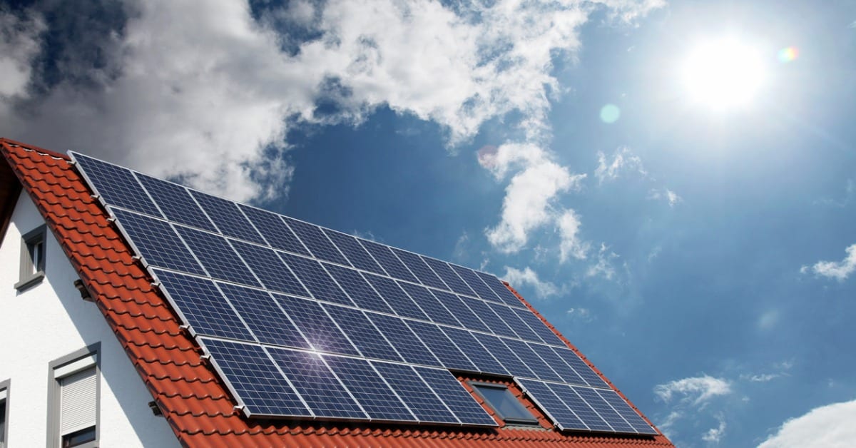 eco friendly home with solar panels on roof