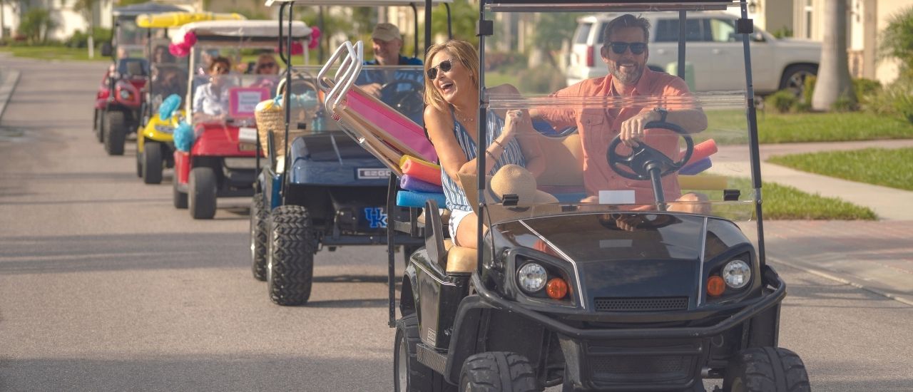 couple on golf cart