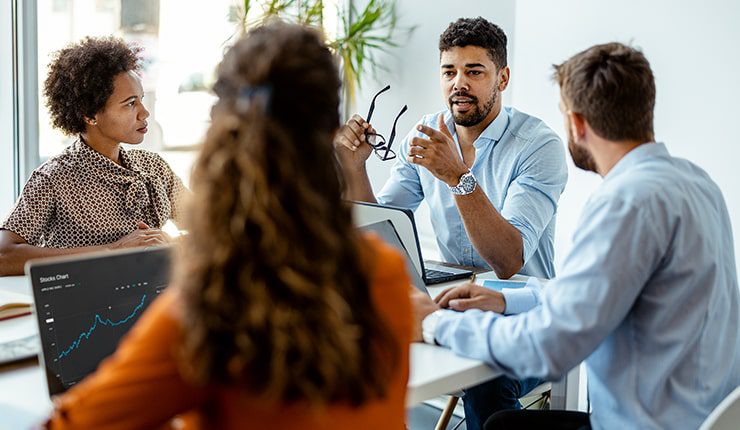 group of employees discussing strategic marketing