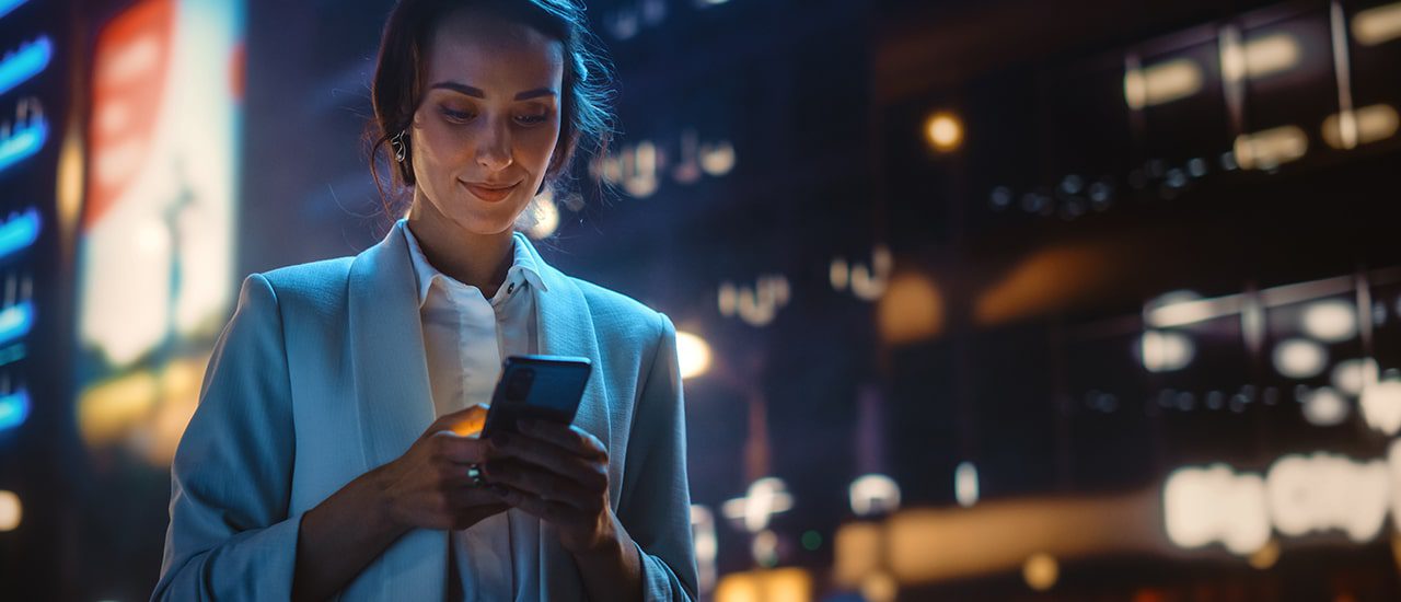woman on her phone in the city