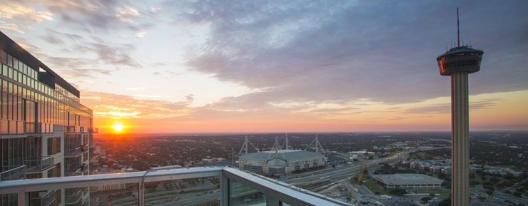 sun setting over city